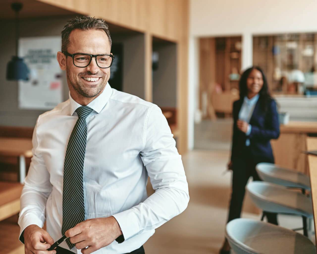 About us Two business professionals walking to a meeting.