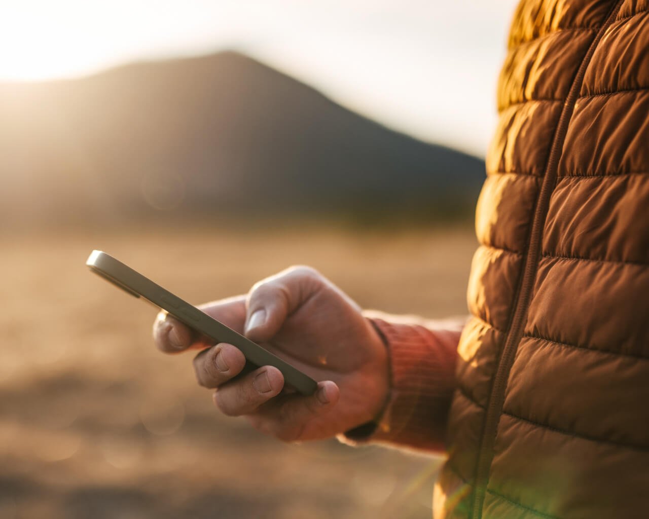A man looking up information on his mobile phone.