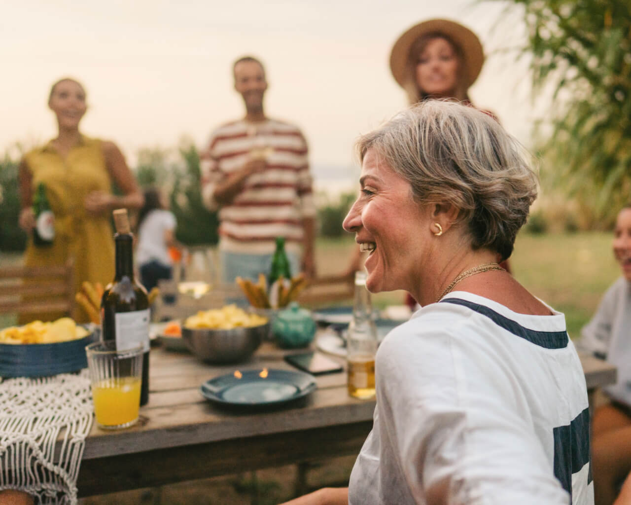 A retired woman spending time with her family.