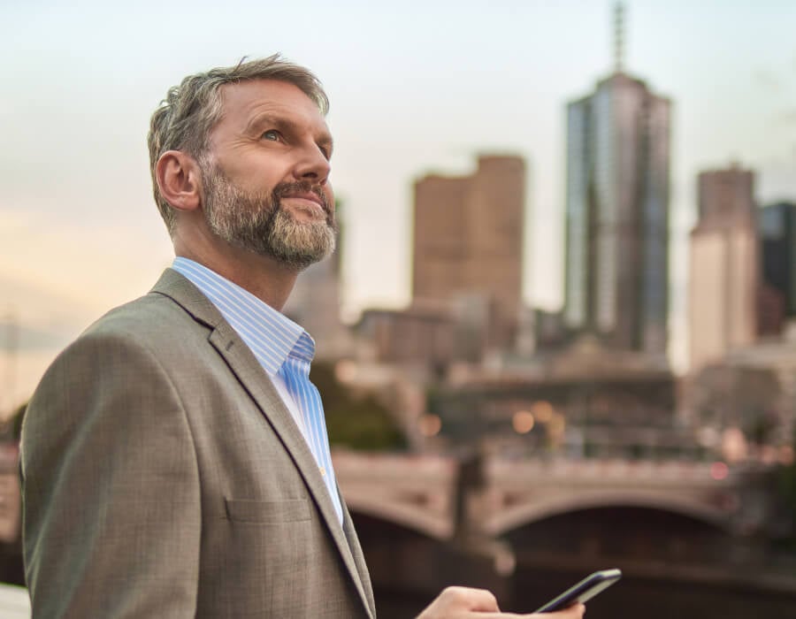 Man checking his phone reversed