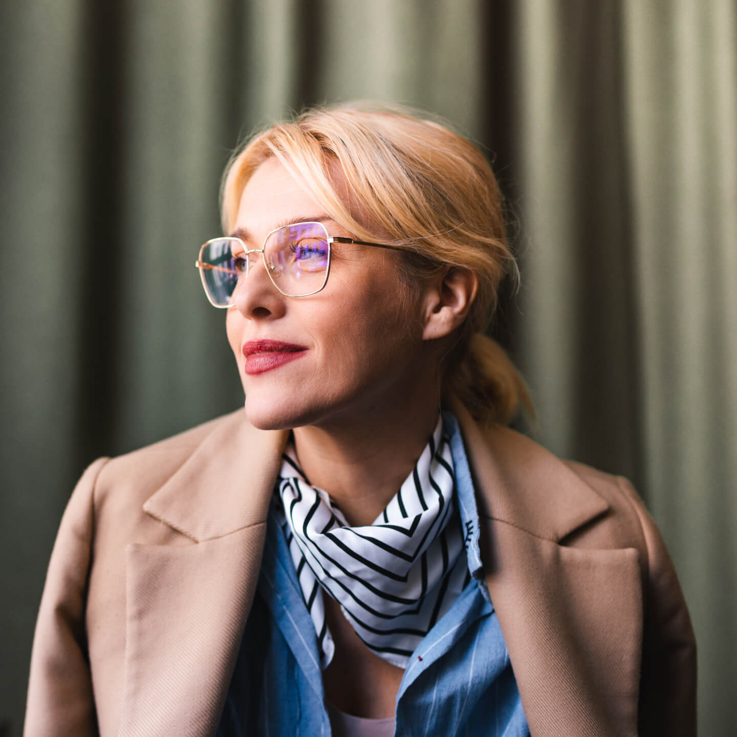 Business woman in office wearing coat