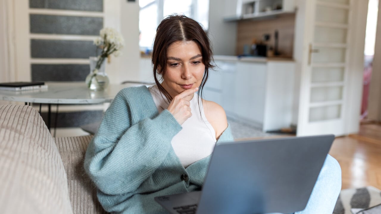 A person working on their laptop seeing how they can maximise super opportunities