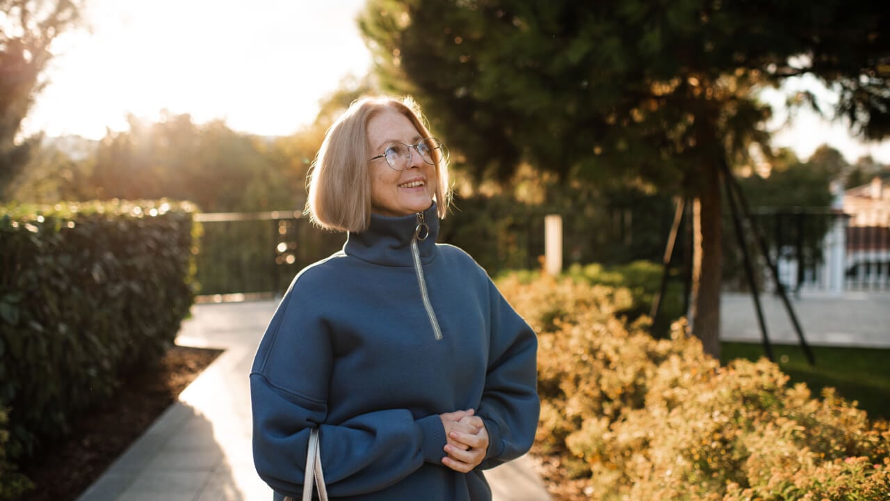 Moving from accumulation to Pension phase A lady going for a walk in the park