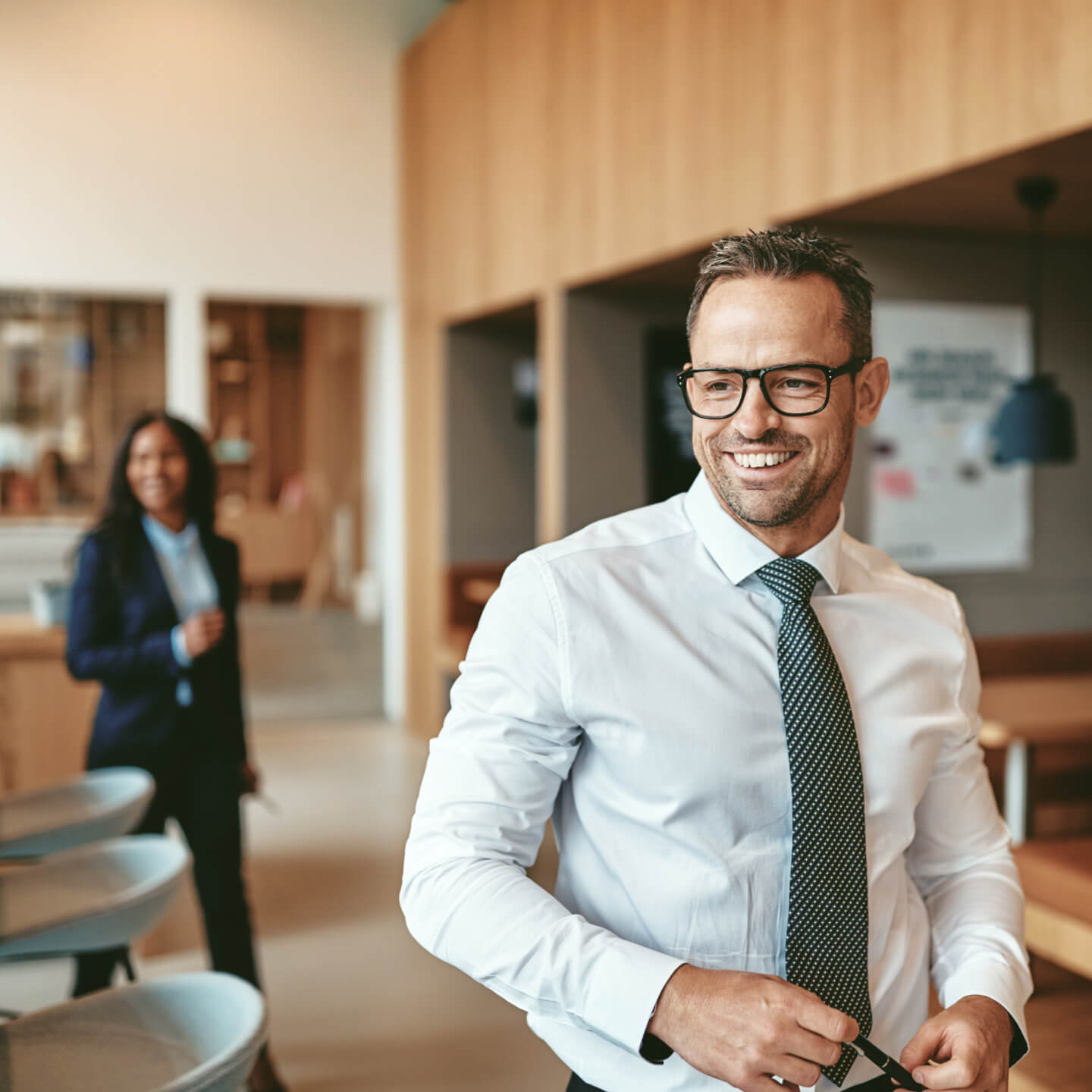 Two office workers walking to meeting