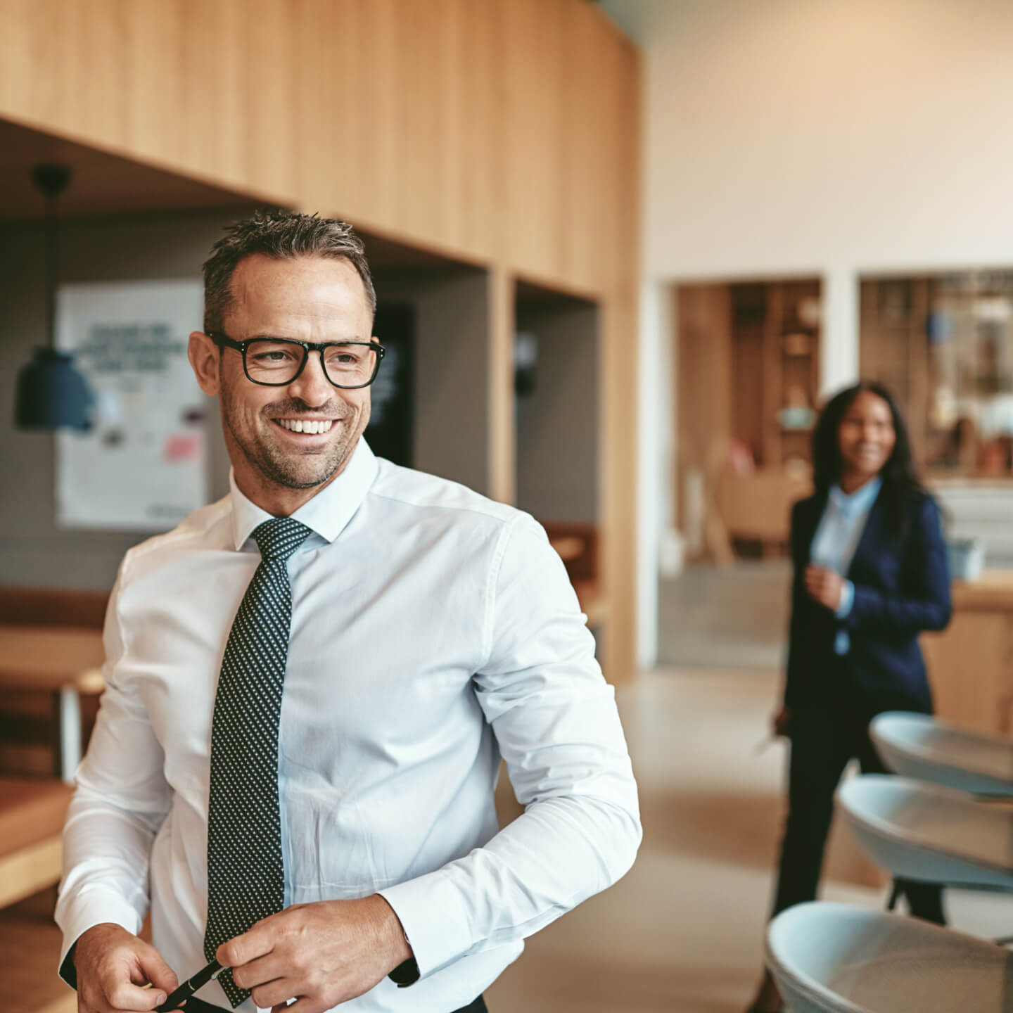 Two office workers walking to meeting