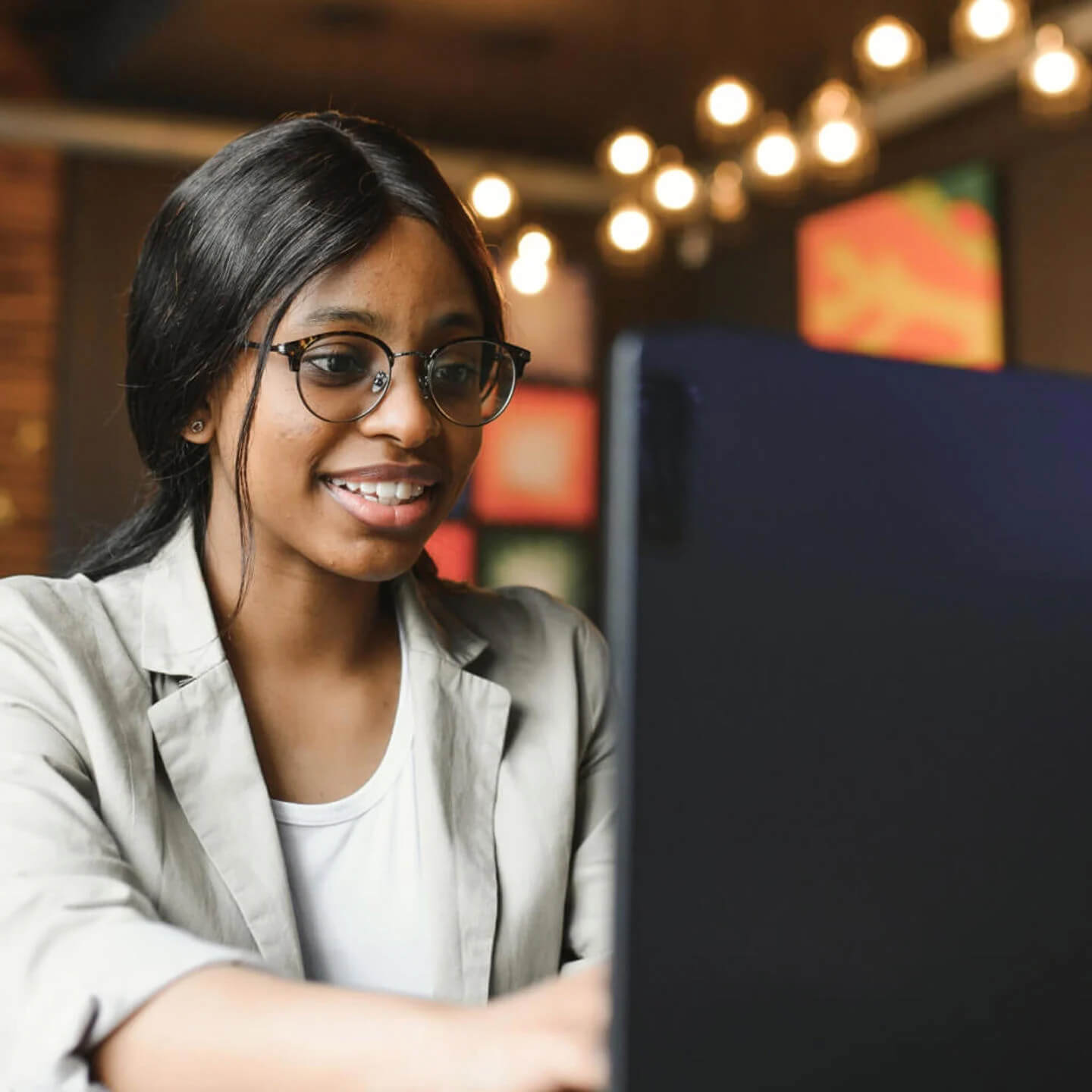 Woman in office working on laptop