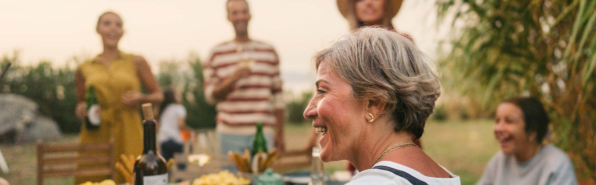 A retired couple spending time in the backyard with family.