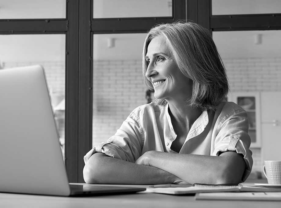 smiling woman laptop coffee large article.jpg