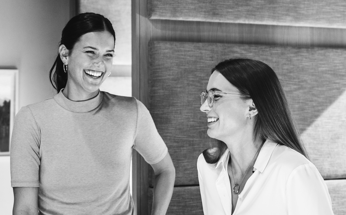 Two women laughing.png