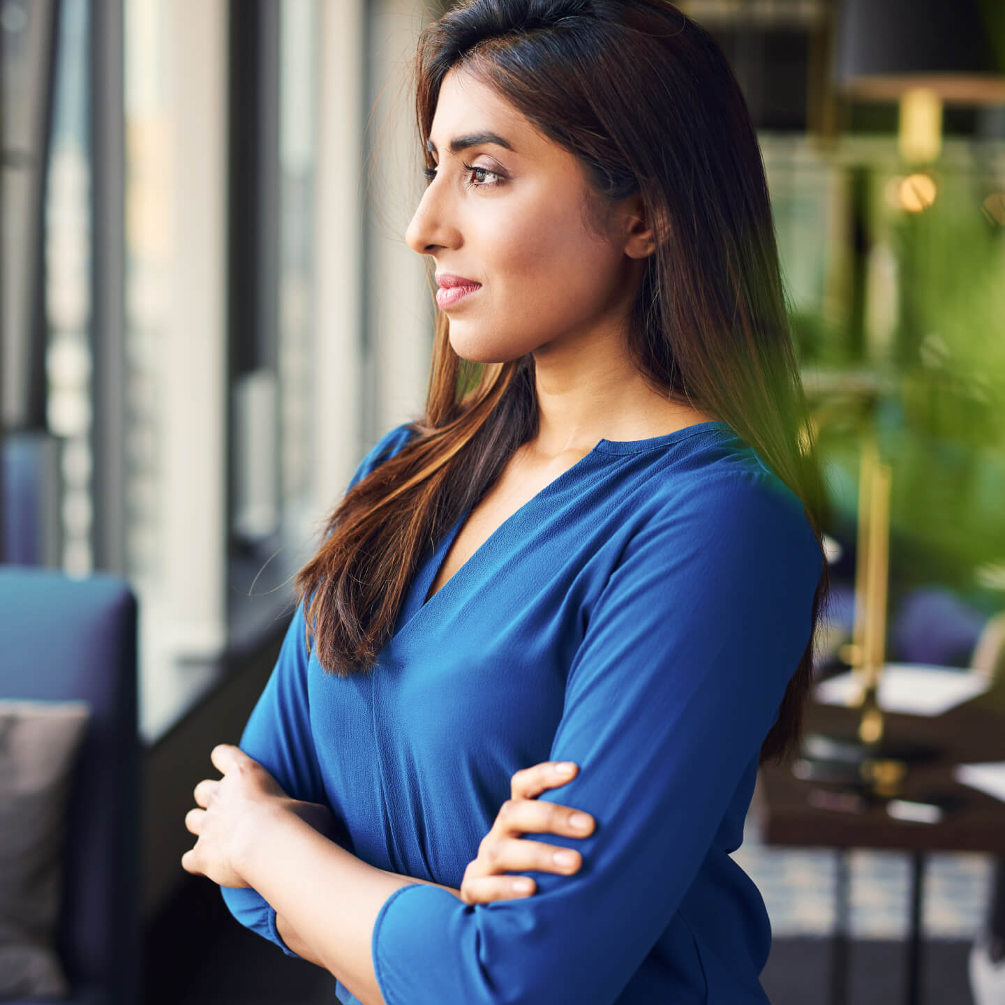 Professional businesswoman folding arms