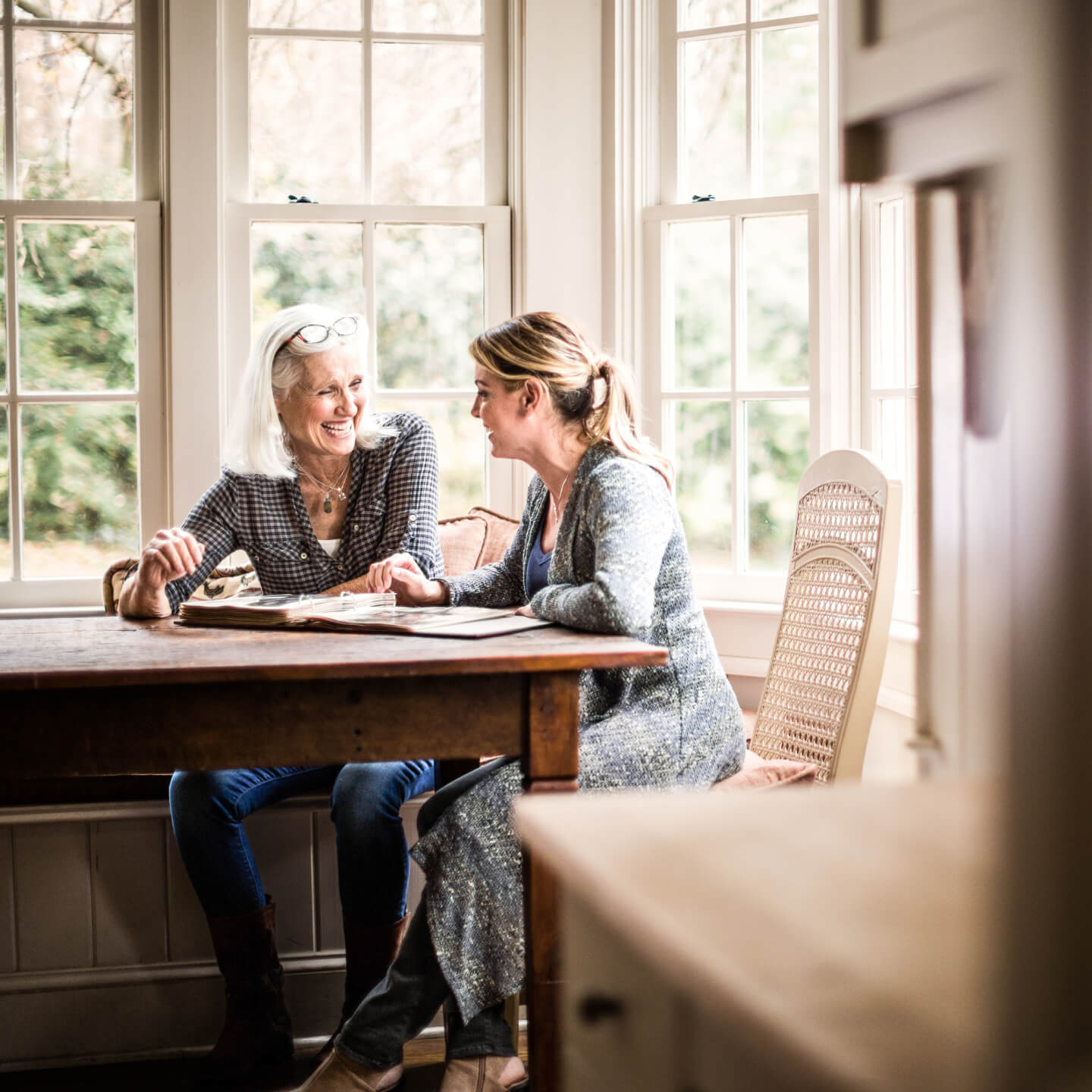 Two women having conversation at table