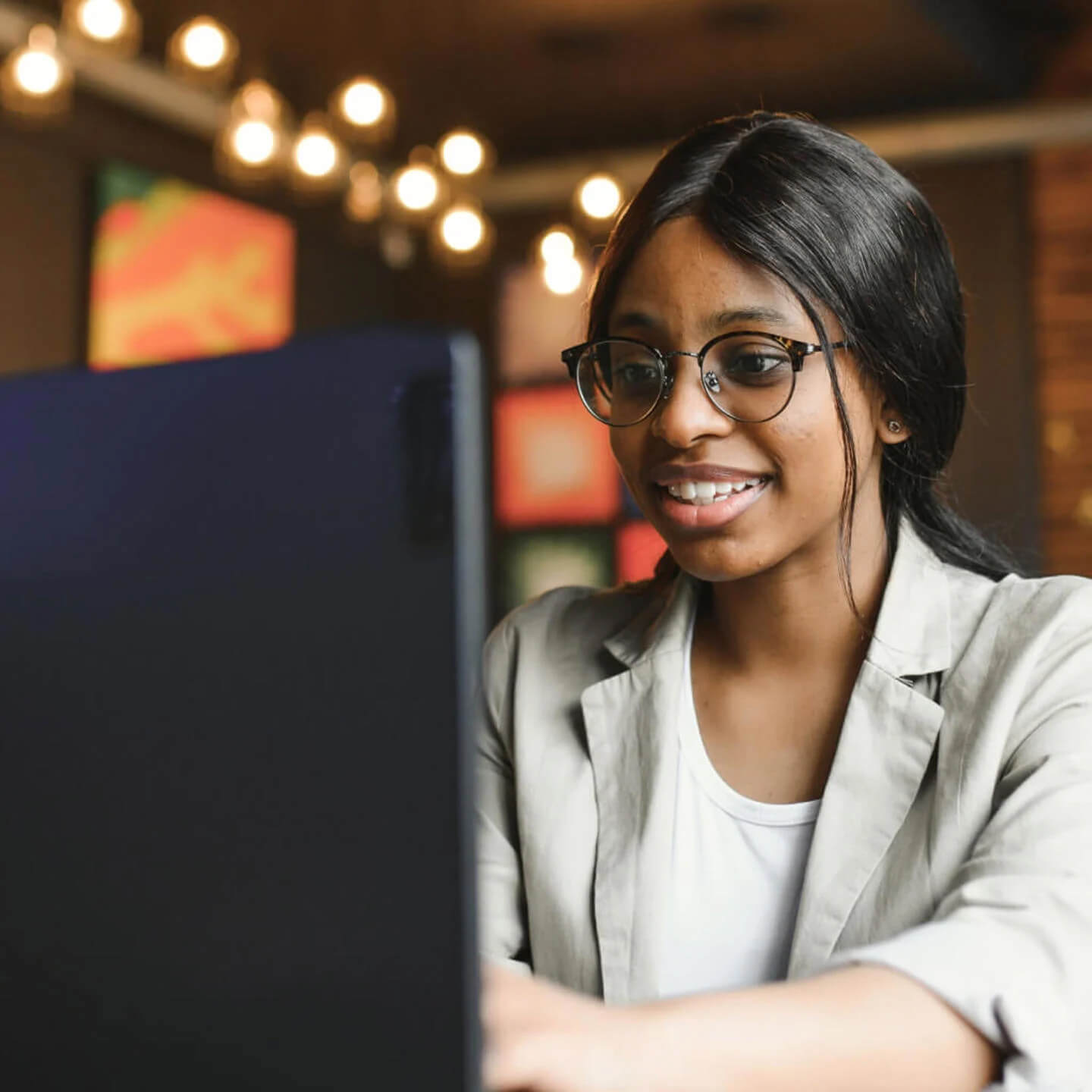 Woman in office working on laptop