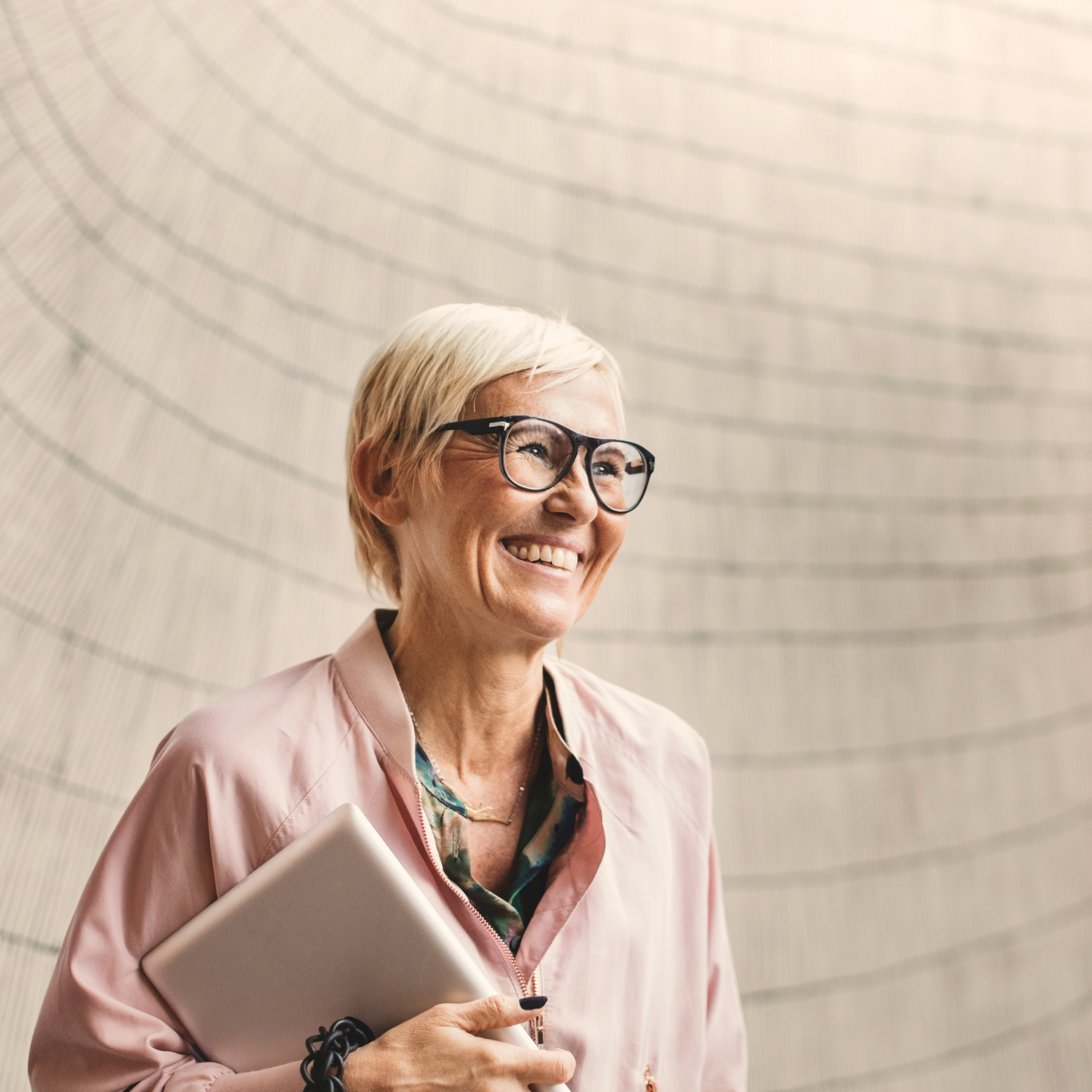 Podcast episode 5: Leading boldly A business leader holding her laptop